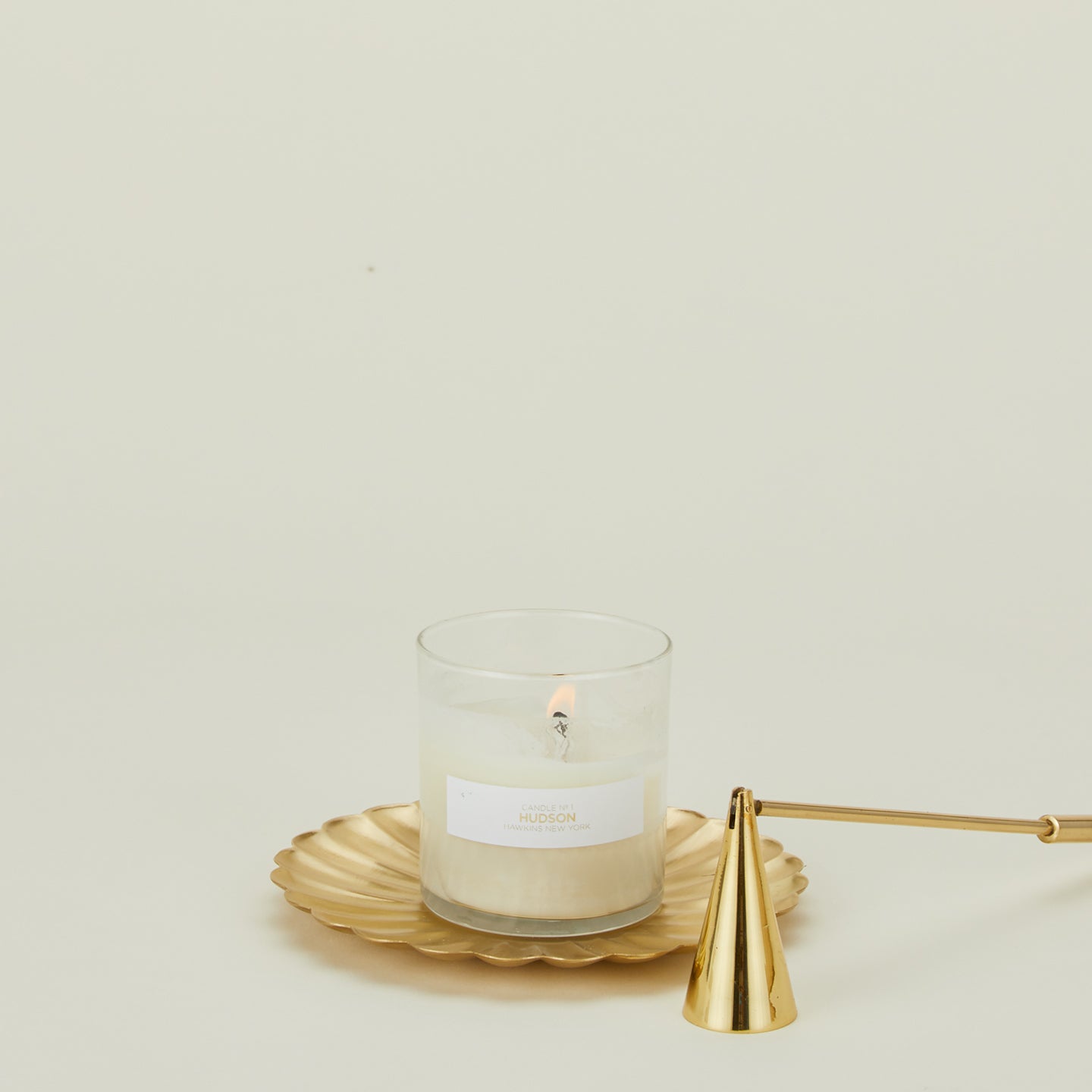 Large brass petal plate with candle and douter