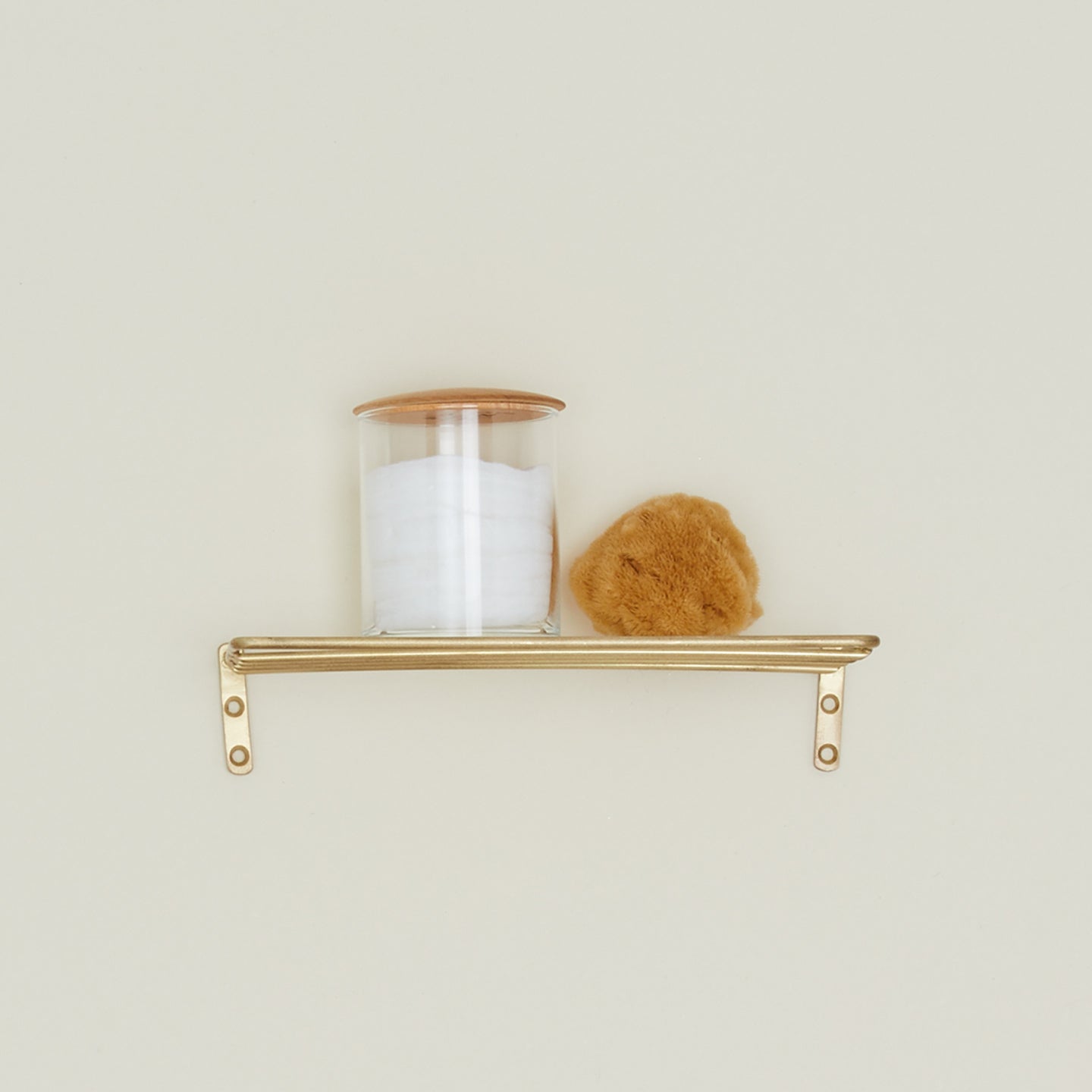 Fog Linen Brass shelf with storage container and sponge.