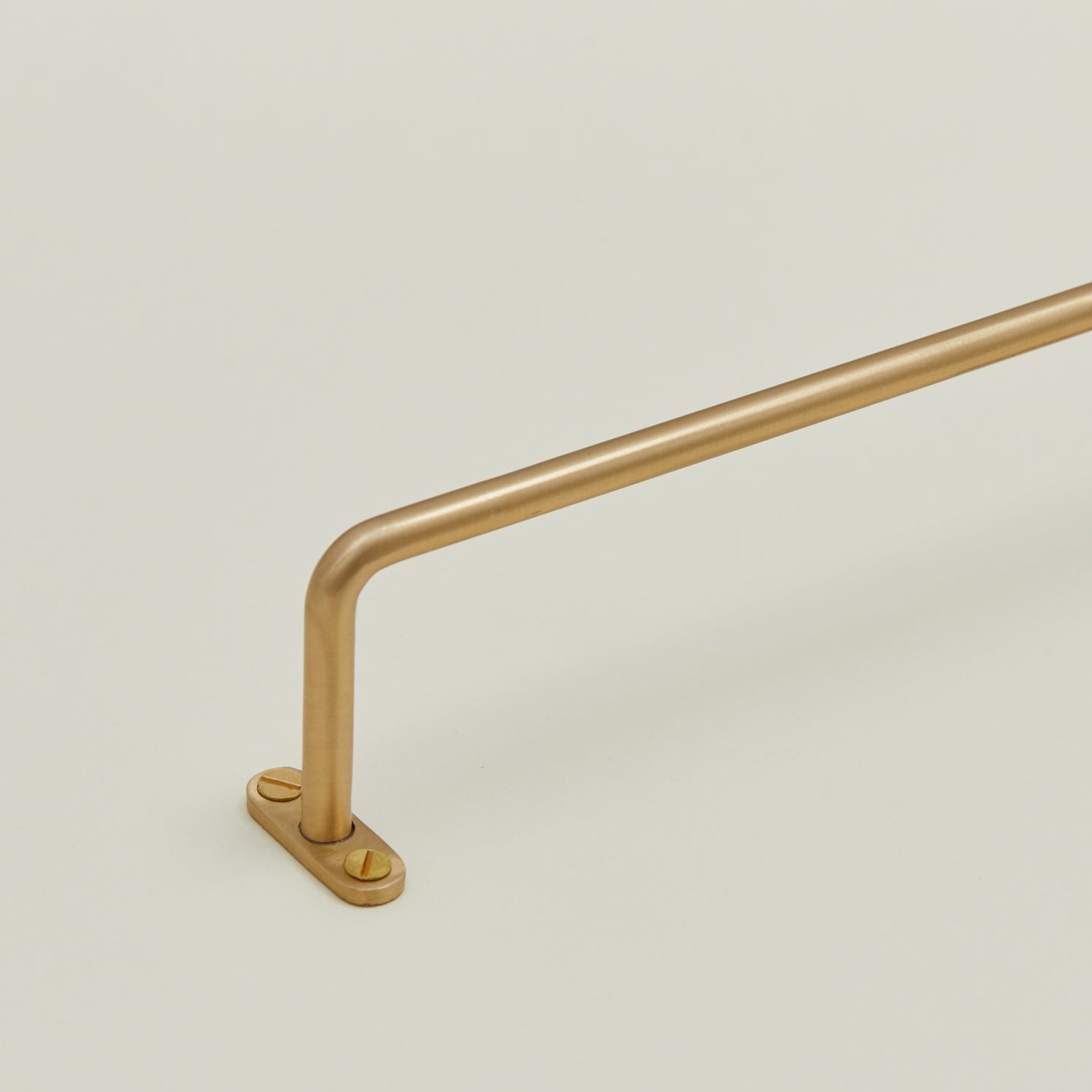 Close up view brass towel bar mounting flange