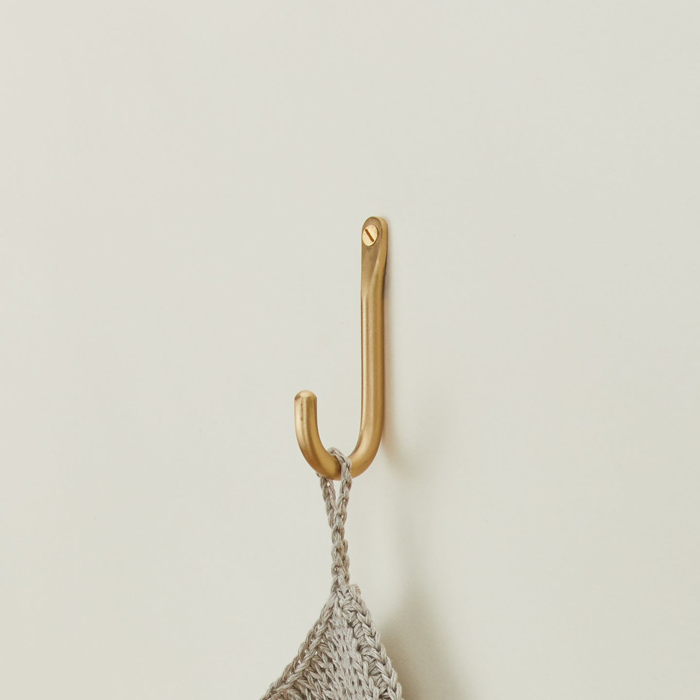 Brass wall hook with towel