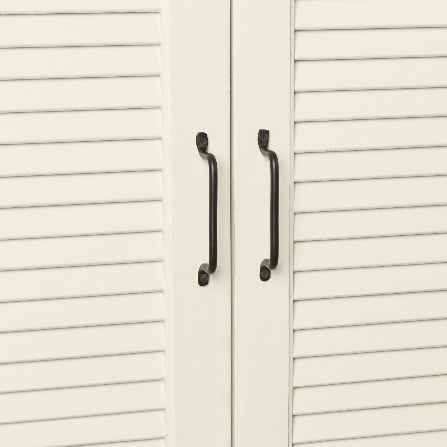 Iron handles in black on cabinet doors