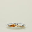 Ginori dinner plate in albus with cheese knife, brie, and crackers