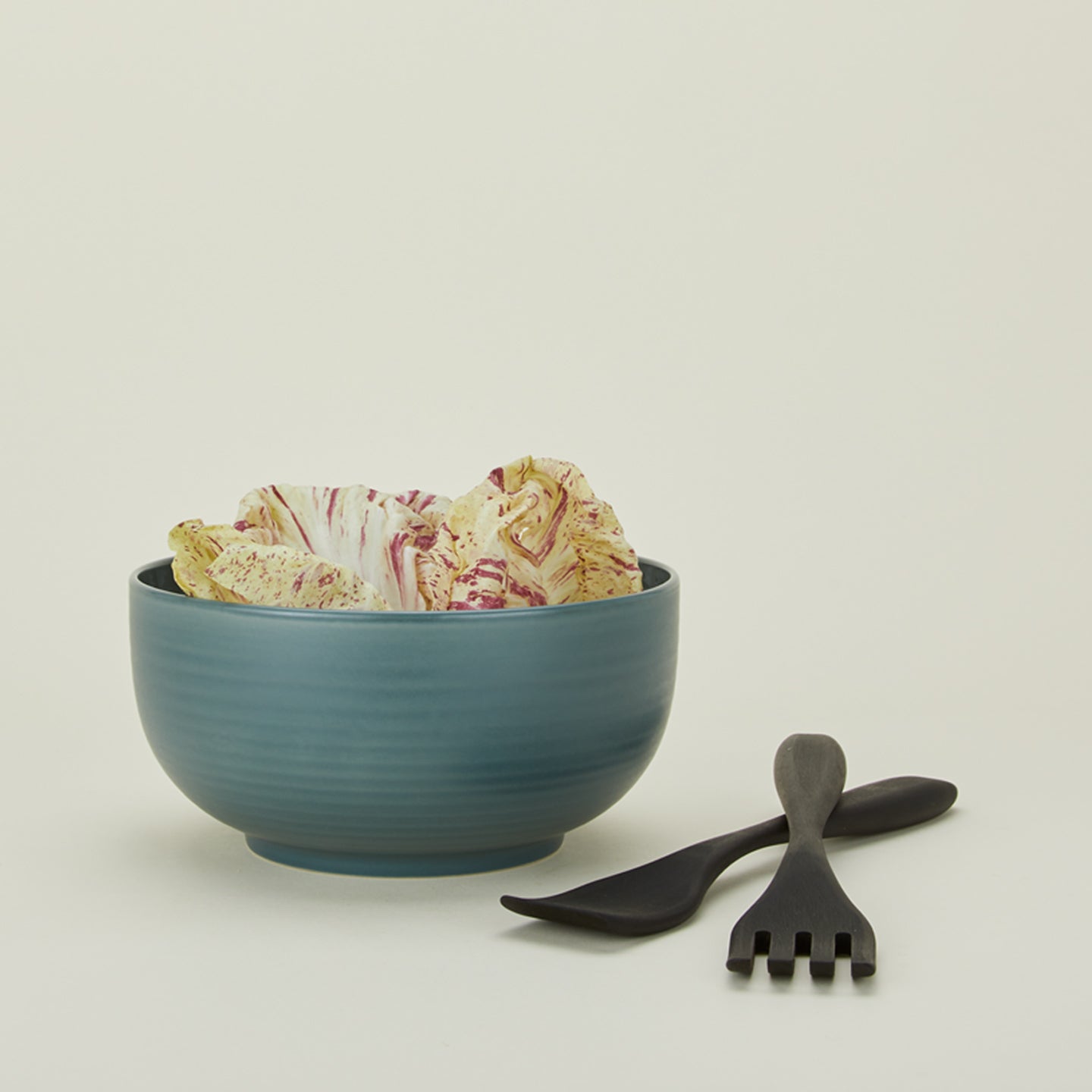 Salad servers in ebonized oak with serving bowl and lettuce
