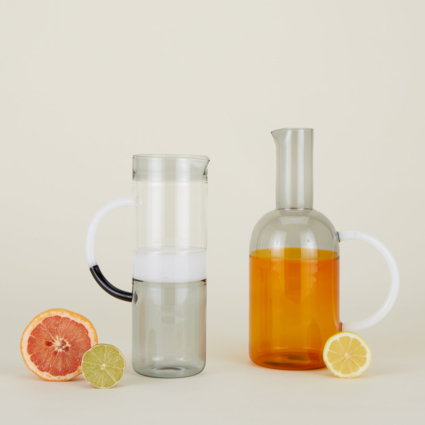 Tequila Sunrise Smoke and Tequila Sunrise Amber along with citrus fruit.