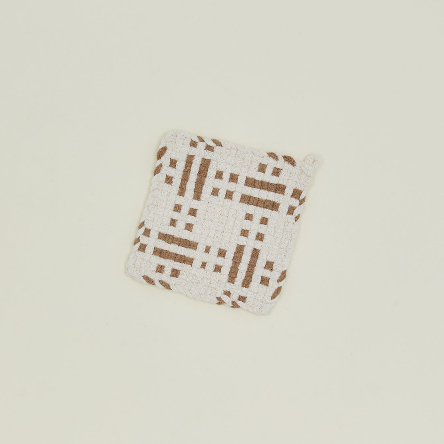 Dots and dashes potholder in white and flax