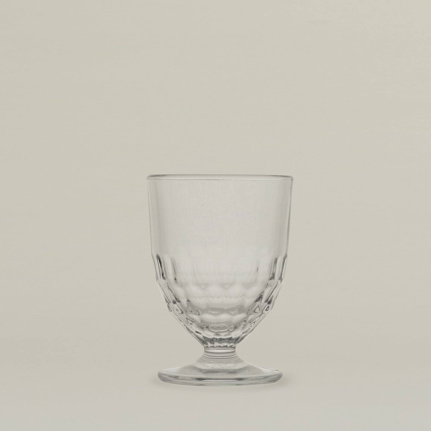 Close up of an Artois wine glass.