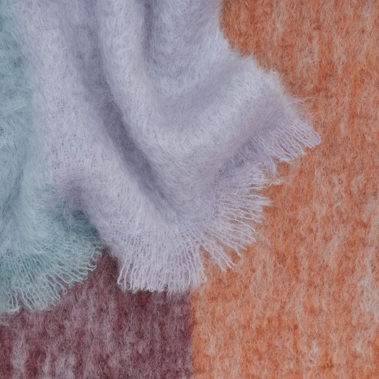 Texture detail of Exploded Plaid Mohair Throw in cool tones. 