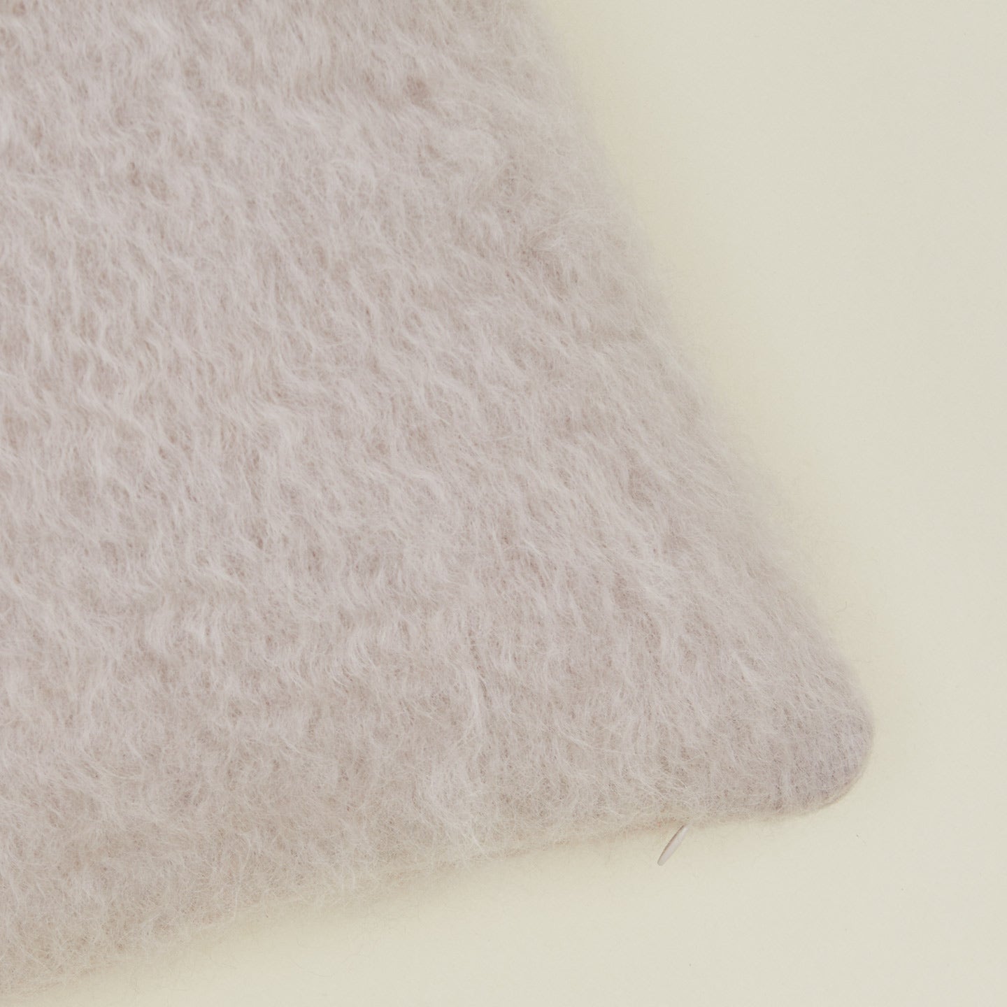 Close up view of Mantas Ezcaray mohair pillow in lilac