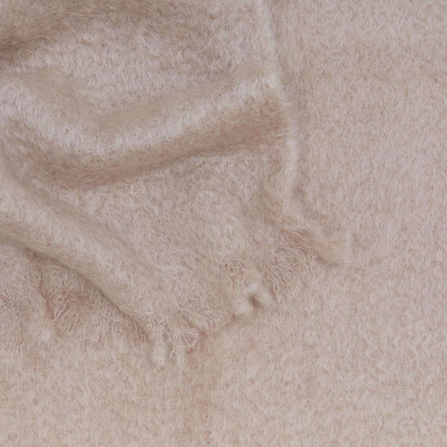 Close up view of solid mohair throw in lilac