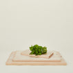 Scalloped cutting board in all 3 sizes with mint leaves