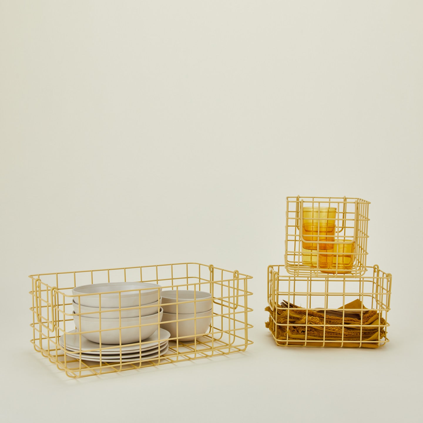 Set of 3 grid baskets in butter with items