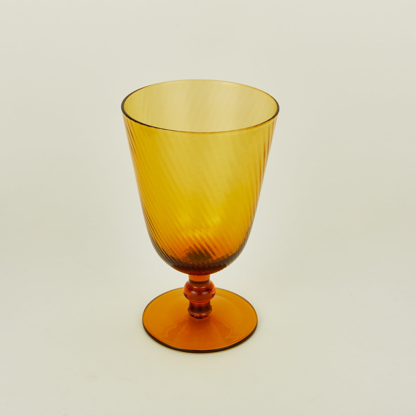Detailed view of optic goblet in amber