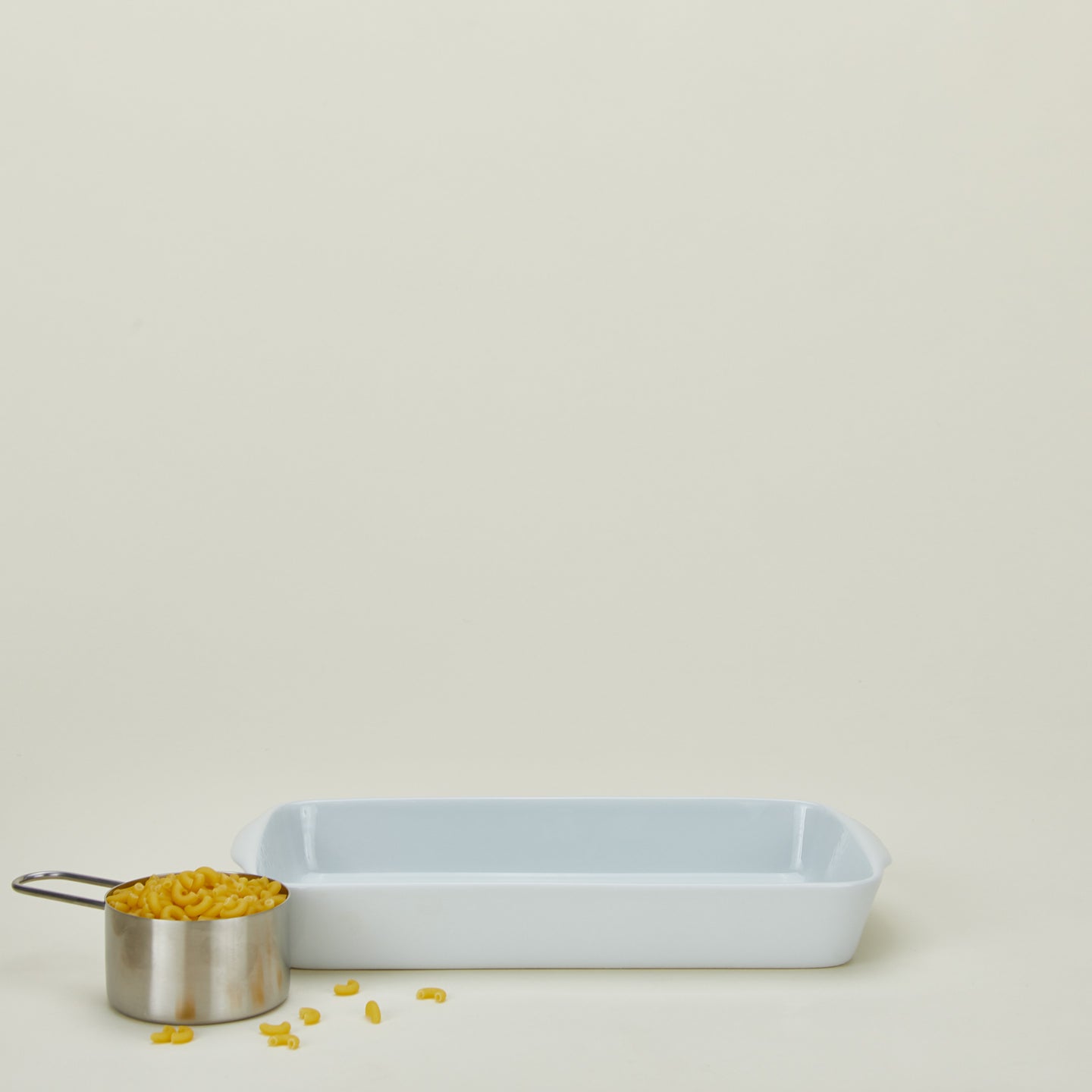 Porcelain rectangular baker in medium with measuring cup of pasta