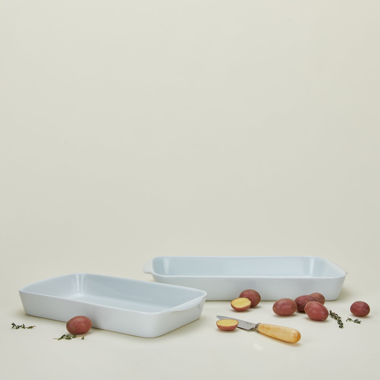 Porcelain rectangular baker in medium and large with knife and potatoes