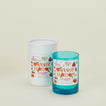 Blue candle with 'Orange Blossom' label and white cylindrical container on a beige background