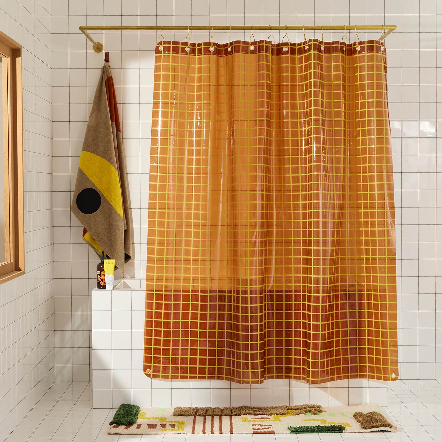 Sun grid shower curtain in honey in bathroom