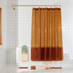 Sunny shower curtain in honey in bathroom