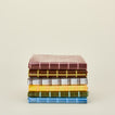 Sun grid shower curtains in various colors.