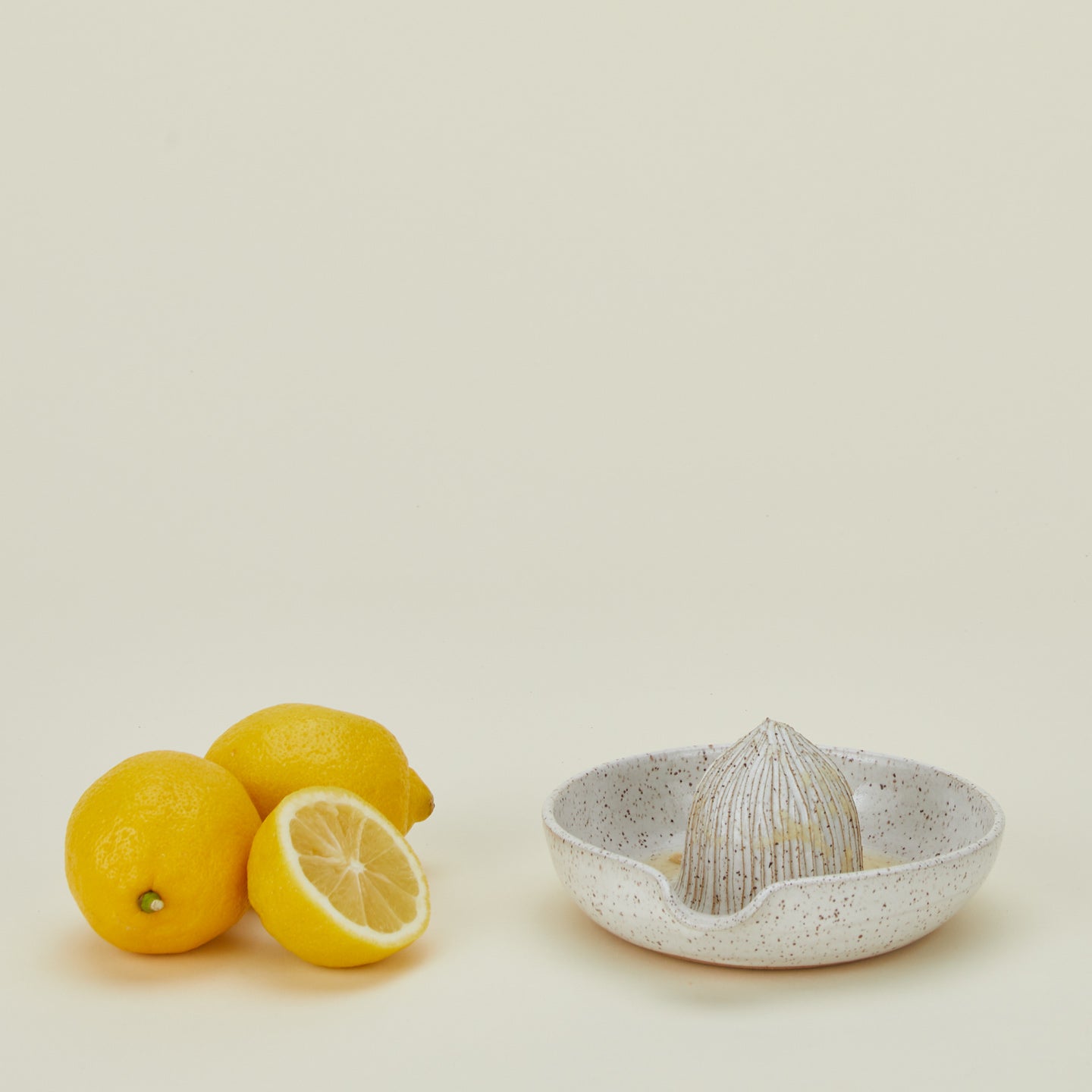 Citrus Juicer in white with lemons