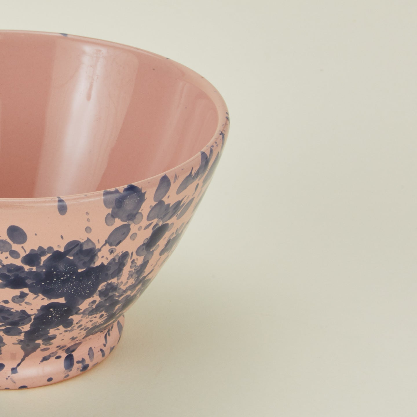 Close up view of Splatter small bowl in pink and blue