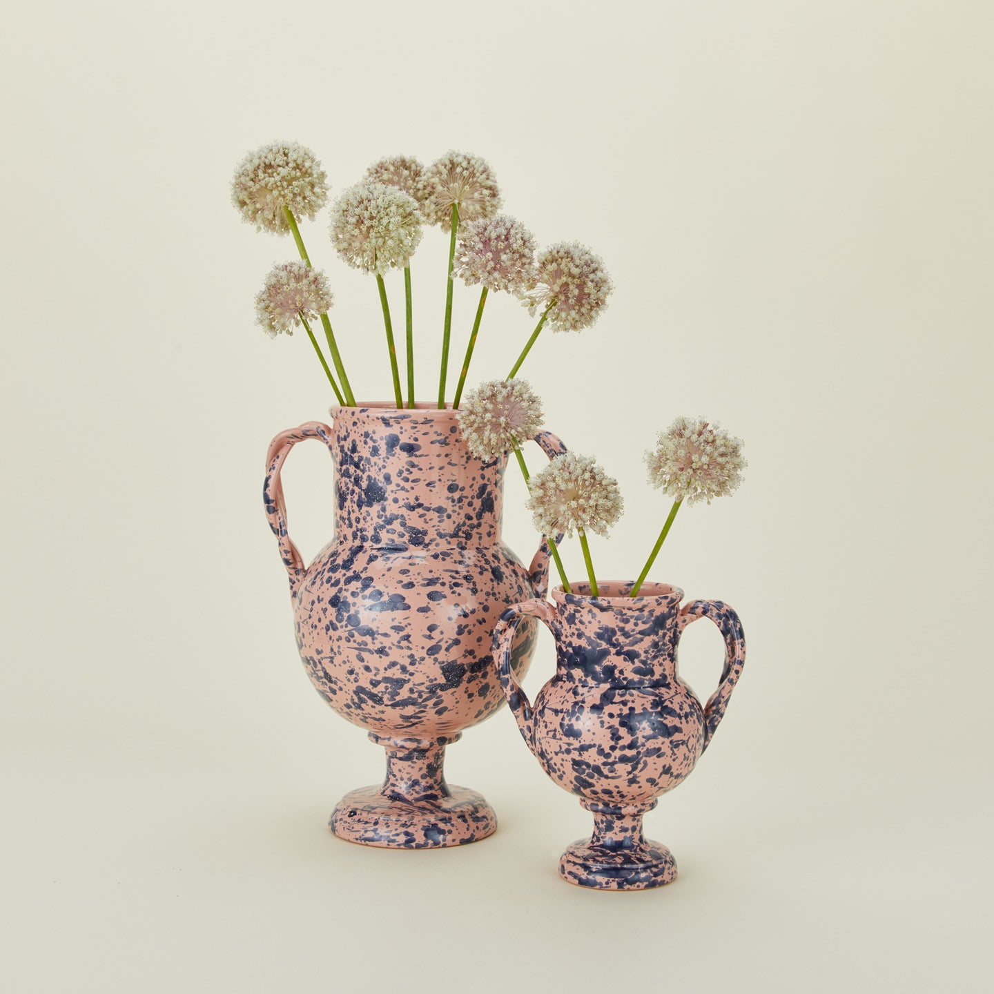 Pink and blue splatter verona vases in large and small with florals