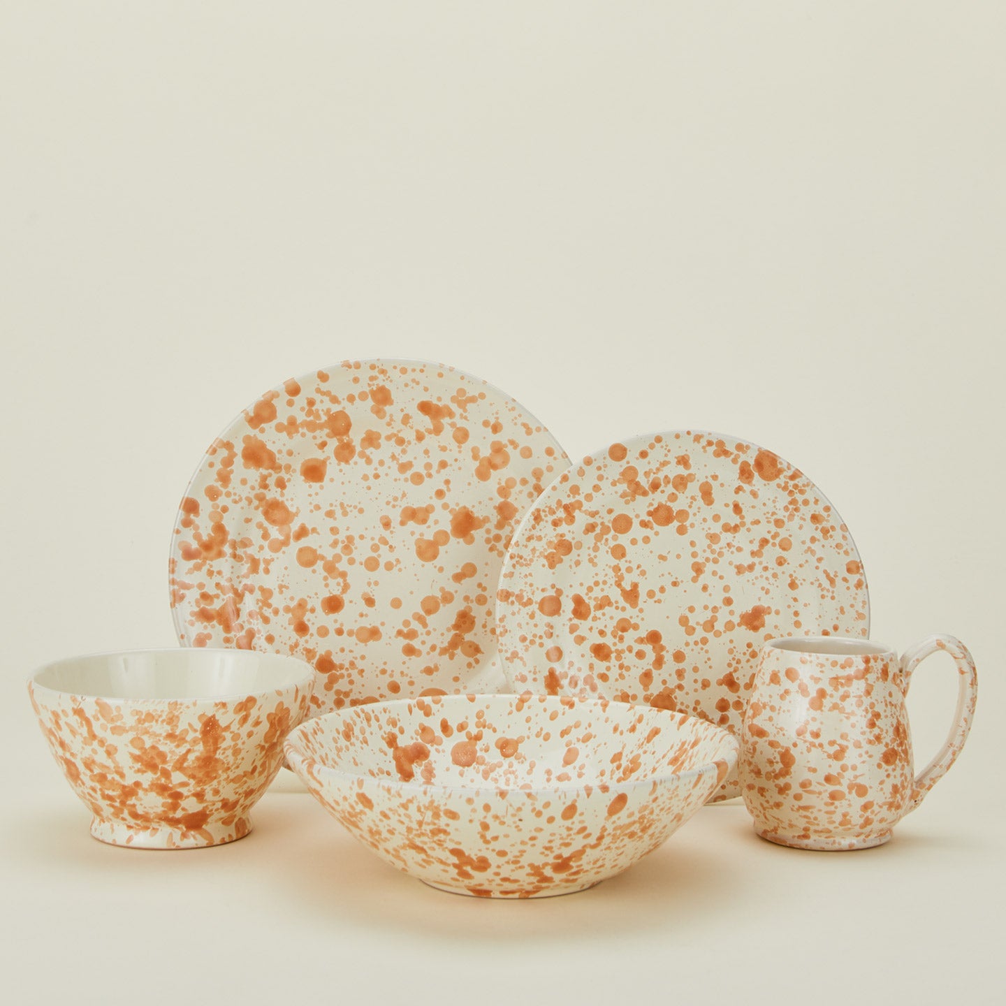 Splatter dinnerware family in tan and ivory