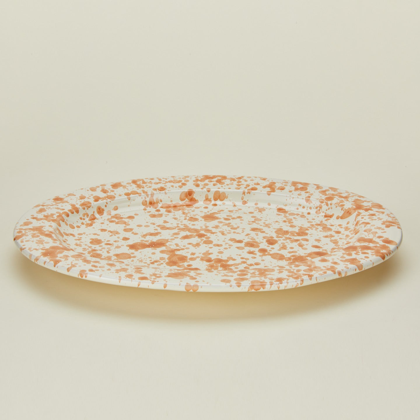 Detailed view of Ivory and tan oval platter