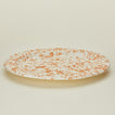 Detailed view of Ivory and tan oval platter