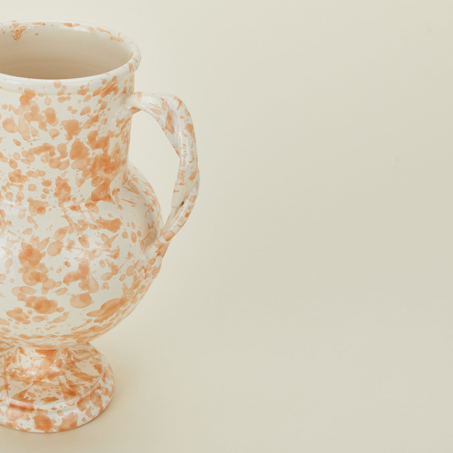 Close up view of tan and ivory vase