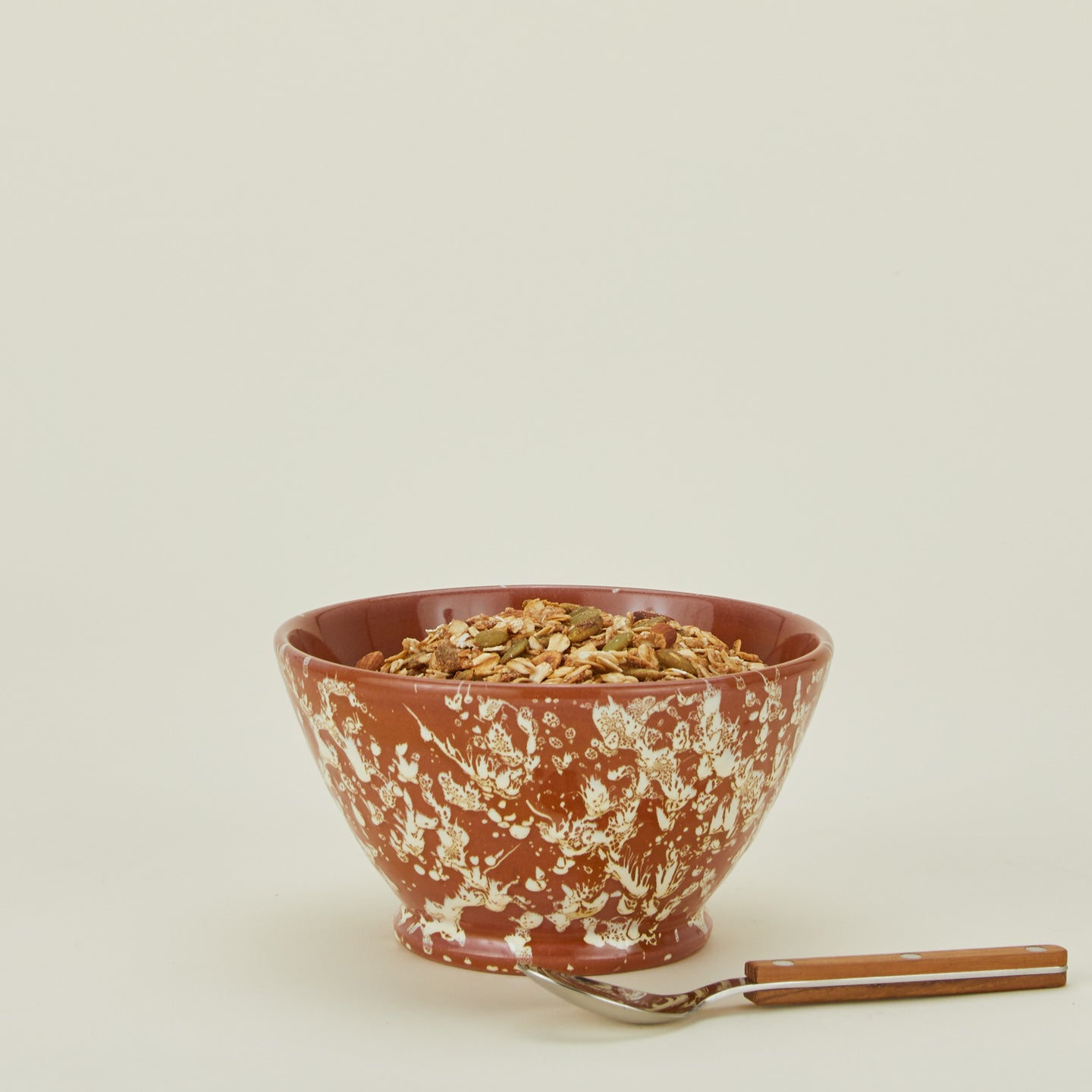 Terracotta ivory splatter small bowl with cereal and spoon