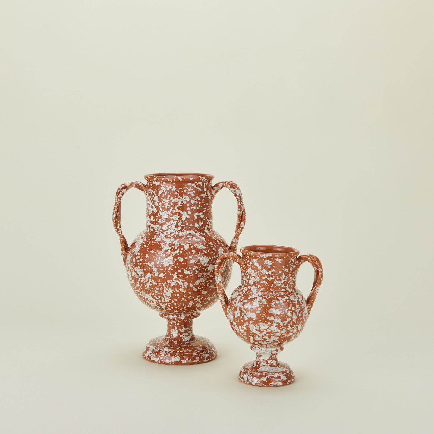 Terracotta and ivory splatter verona vases in large and small