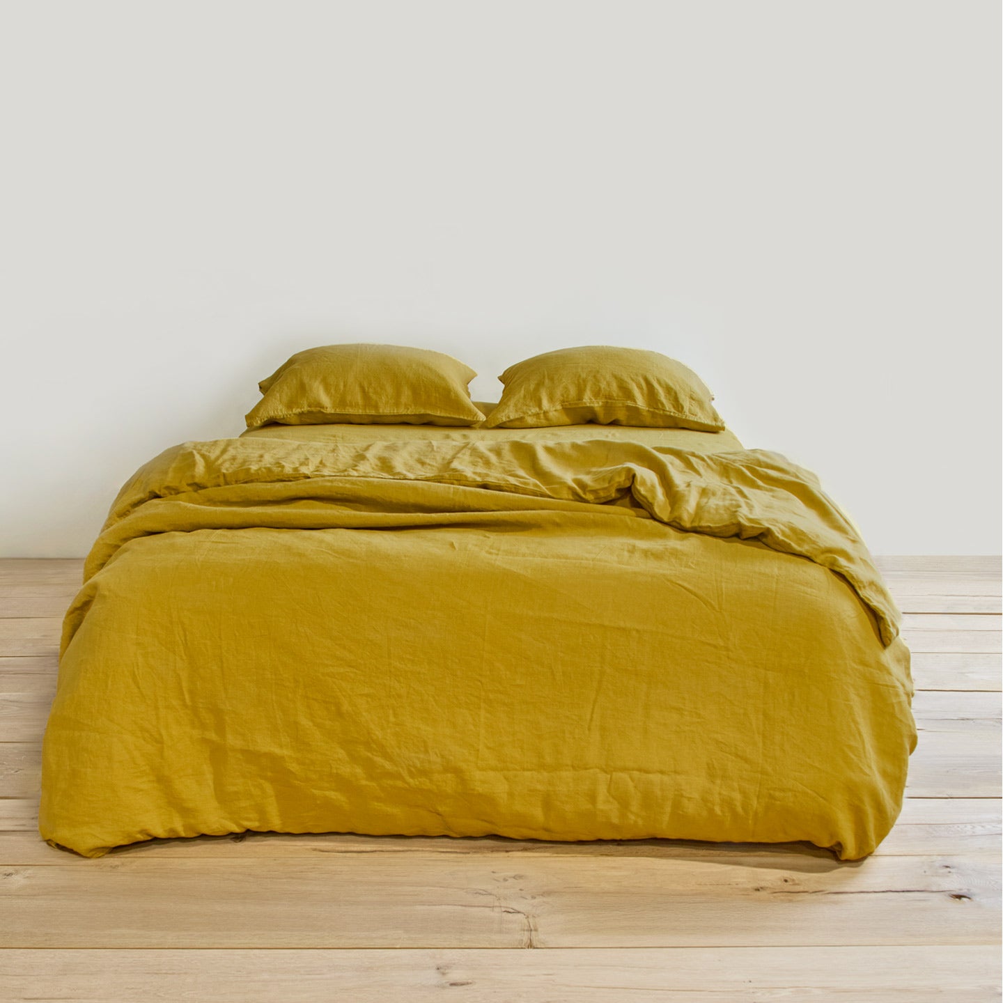 Simple linen bedding in mustard