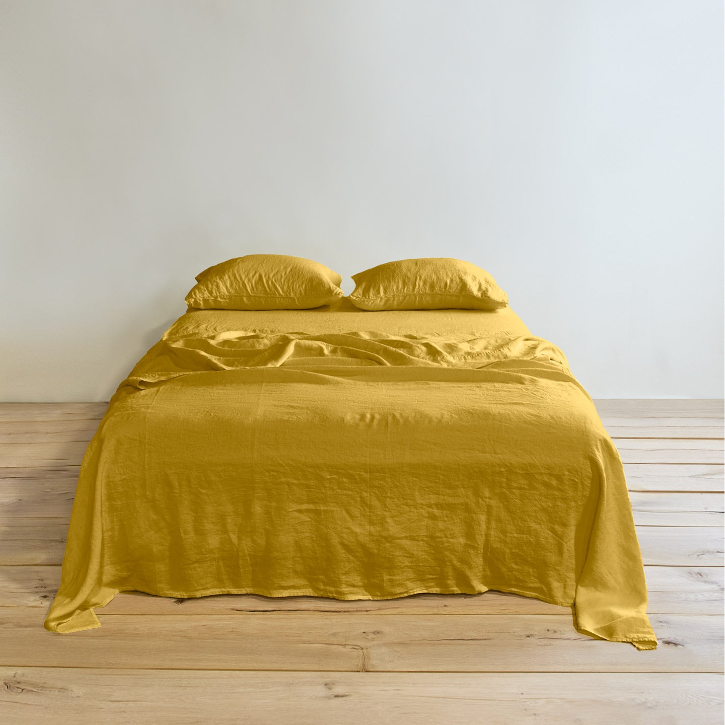 Simple linen bedding in mustard