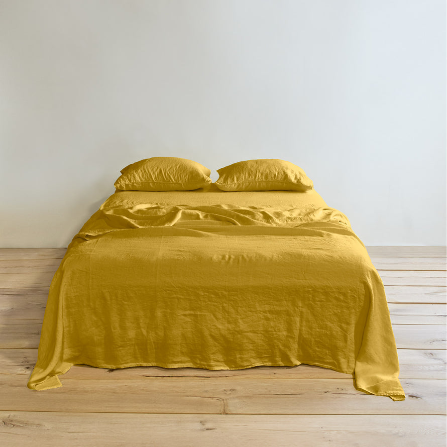 Simple linen bedding in mustard