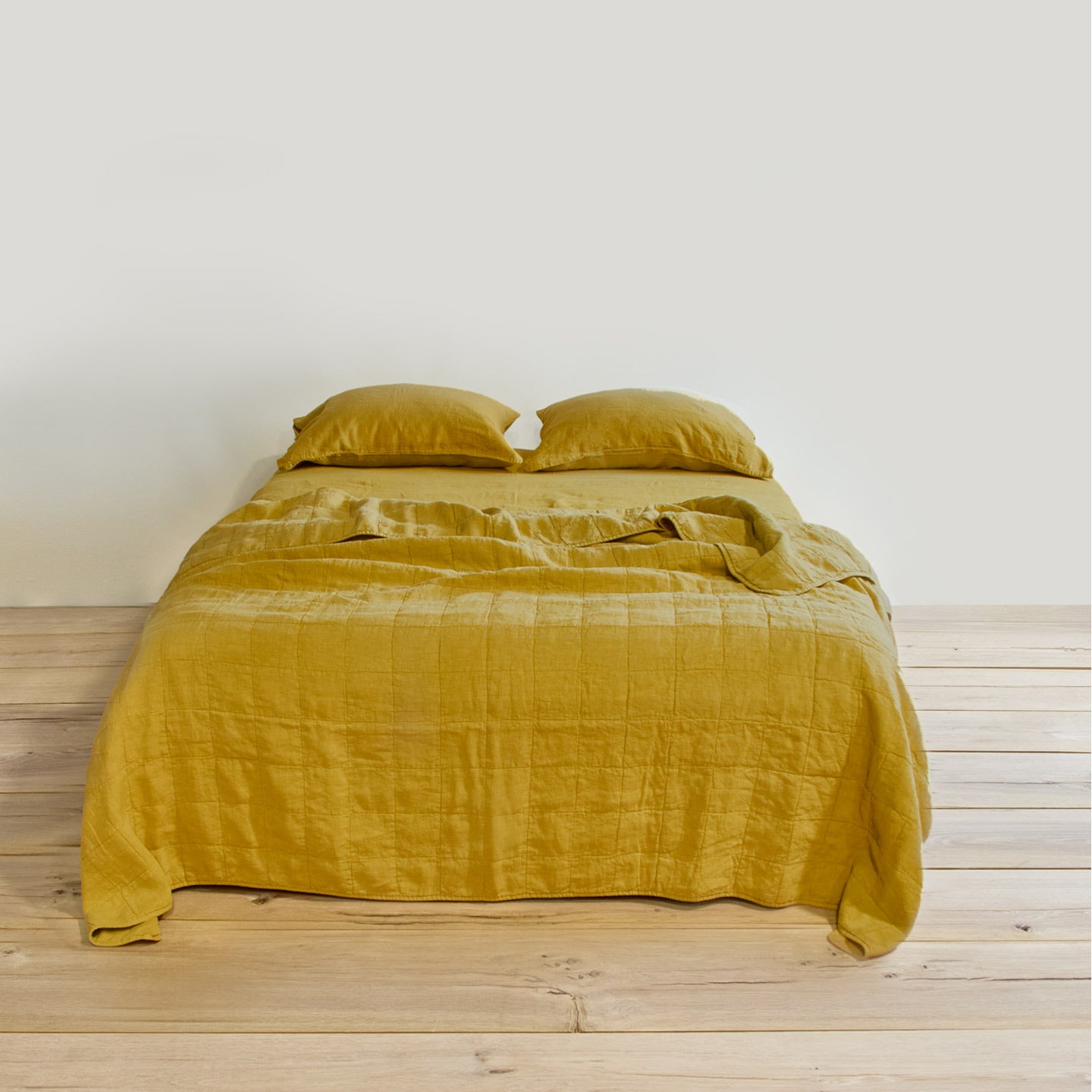 Simple linen bedding in mustard