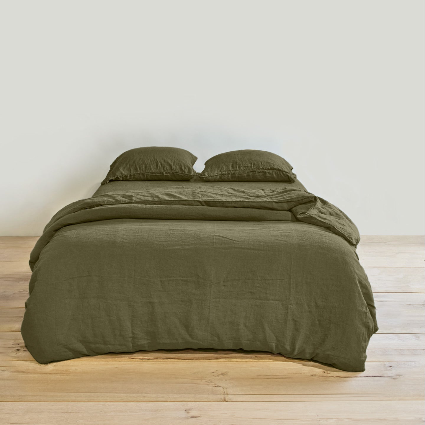 Simple linen bedding in olive