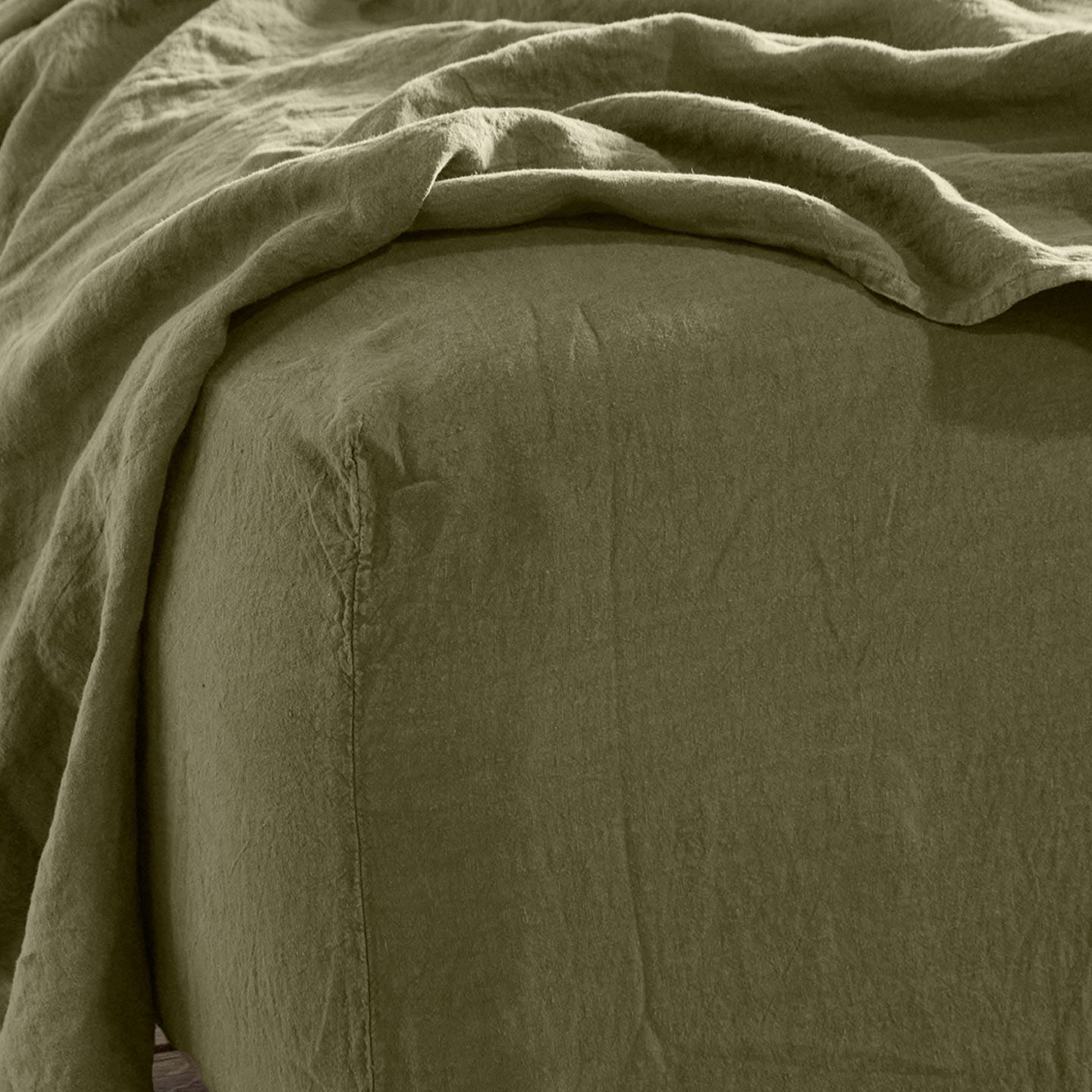 Simple linen bedding in olive