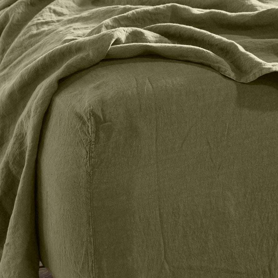 Simple linen bedding in olive