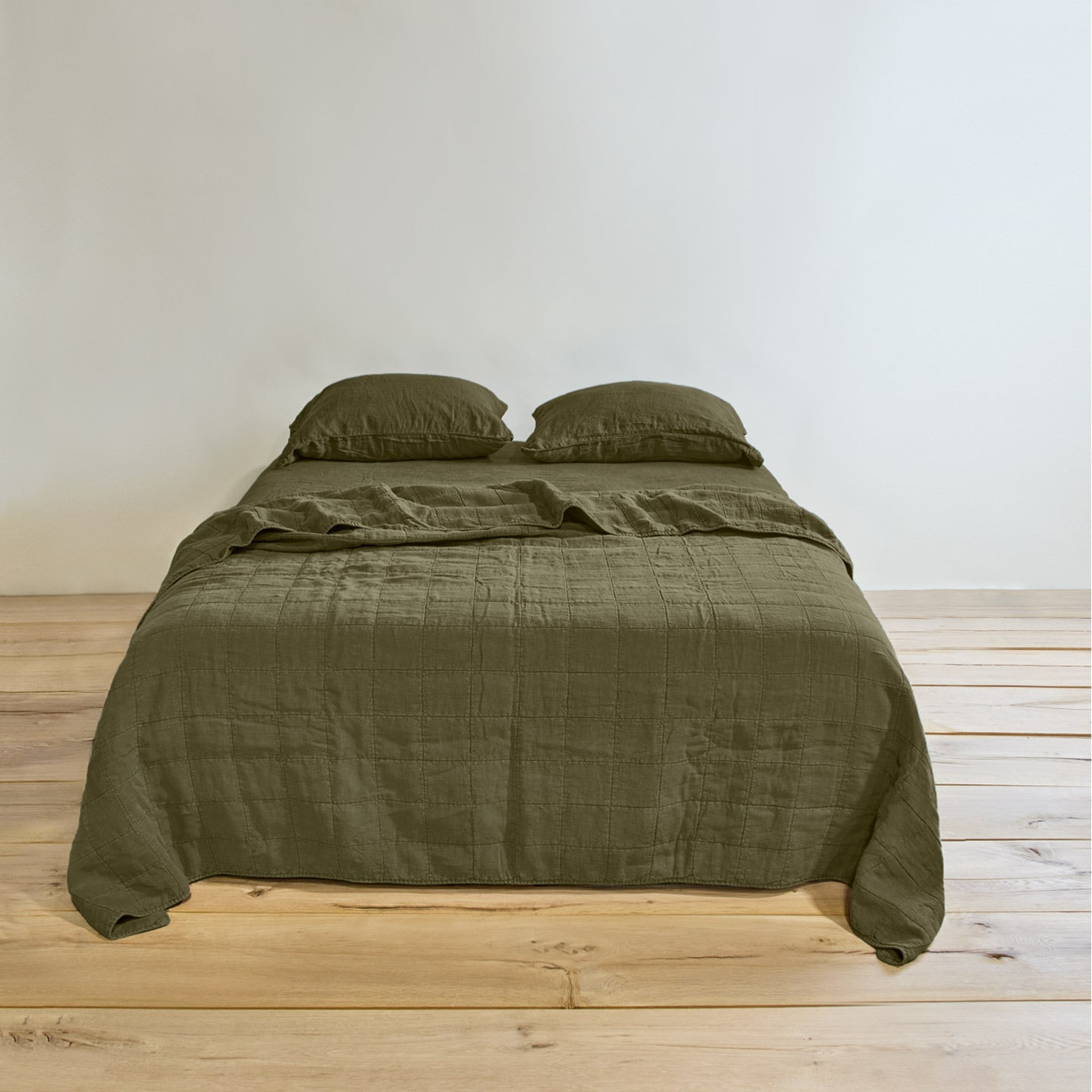 Simple linen bedding in olive