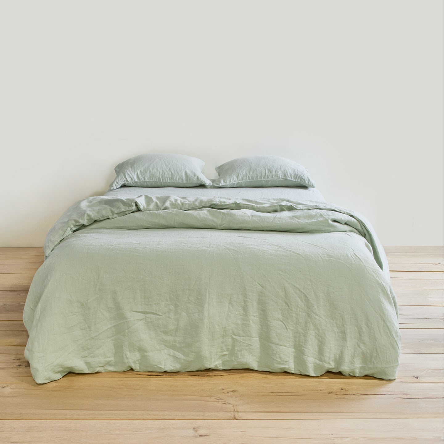 Simple linen bedding in sage