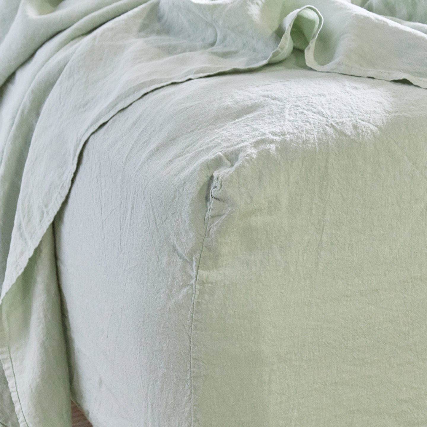Simple linen bedding in sage