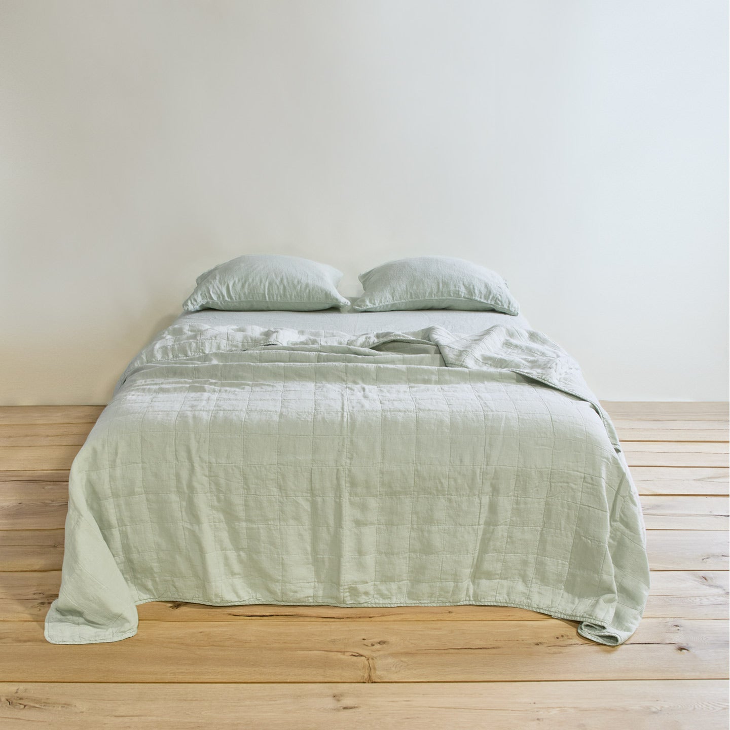 Simple linen bedding in sage