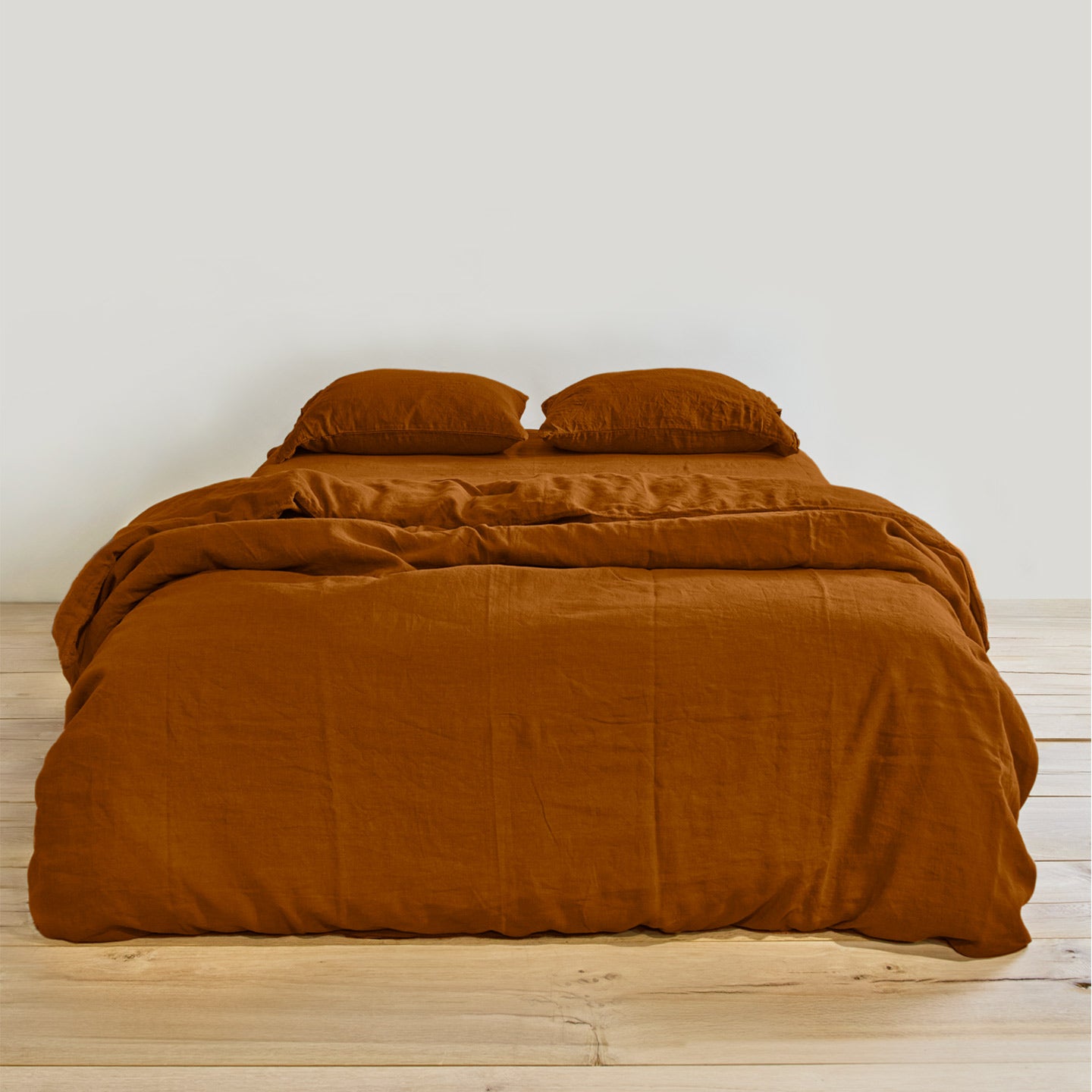 Simple linen bedding in terracotta