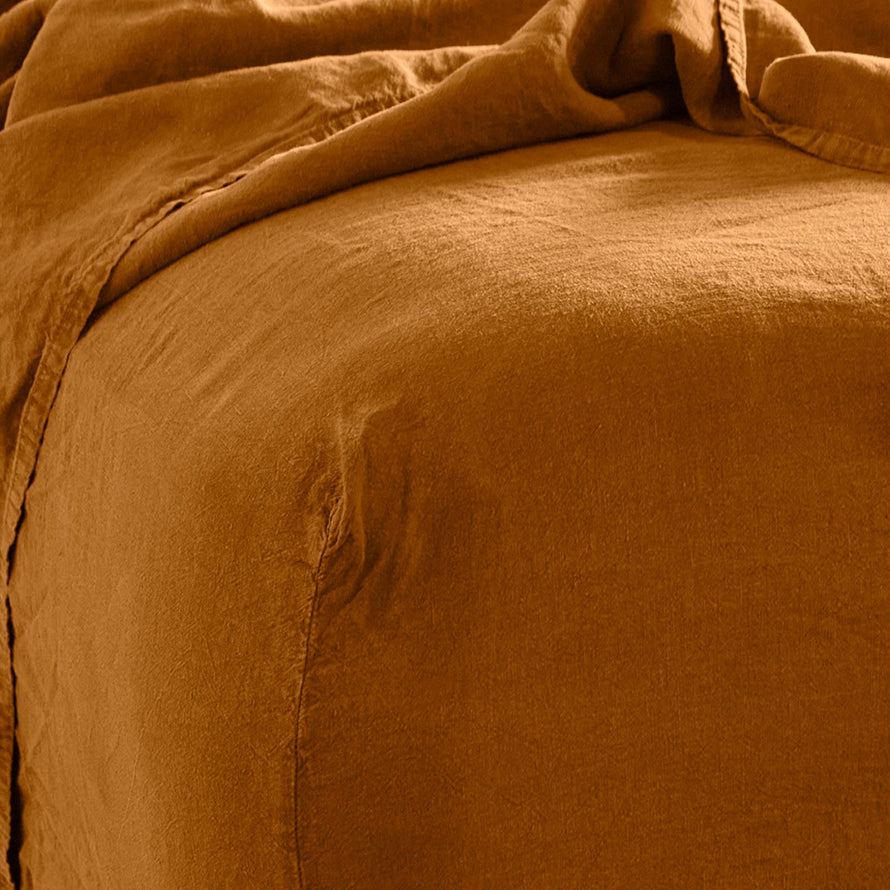 Simple linen bedding in terracotta