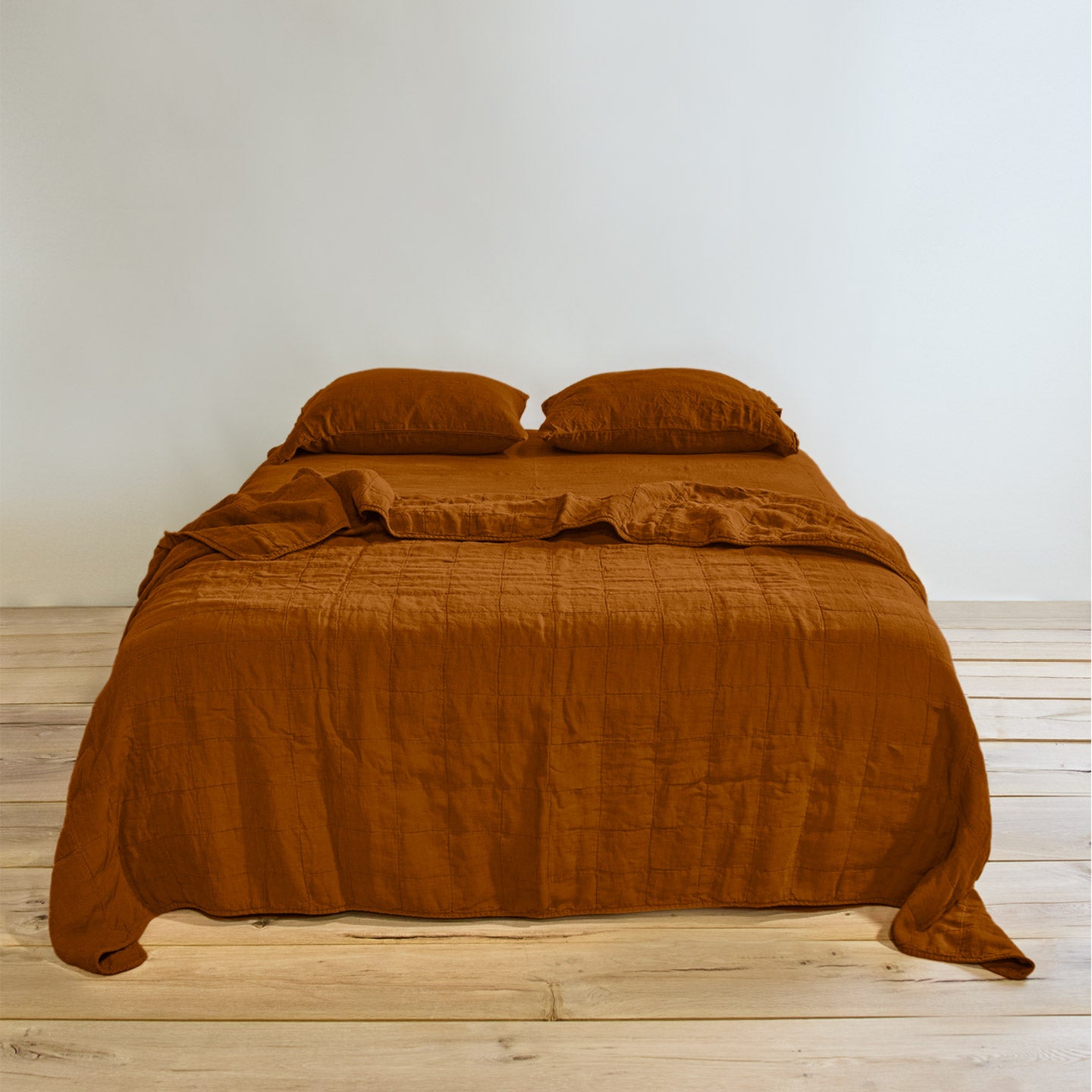 Simple linen bedding in terracotta