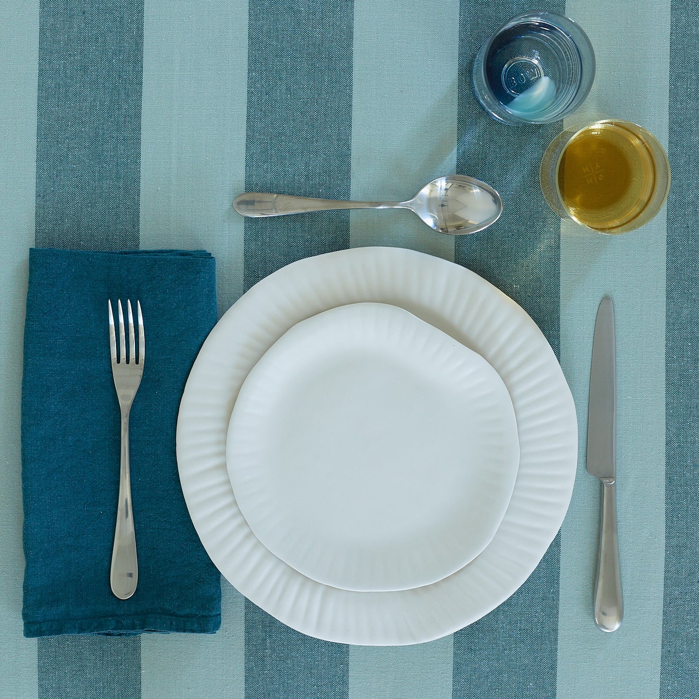 Placesetting with Simple Linen Napkin in Peacock.