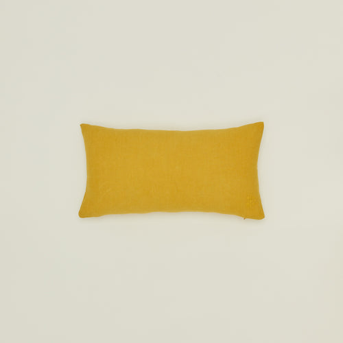 Simple linen pillow in mustard