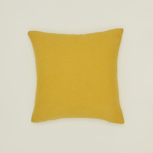 Simple linen pillow in mustard