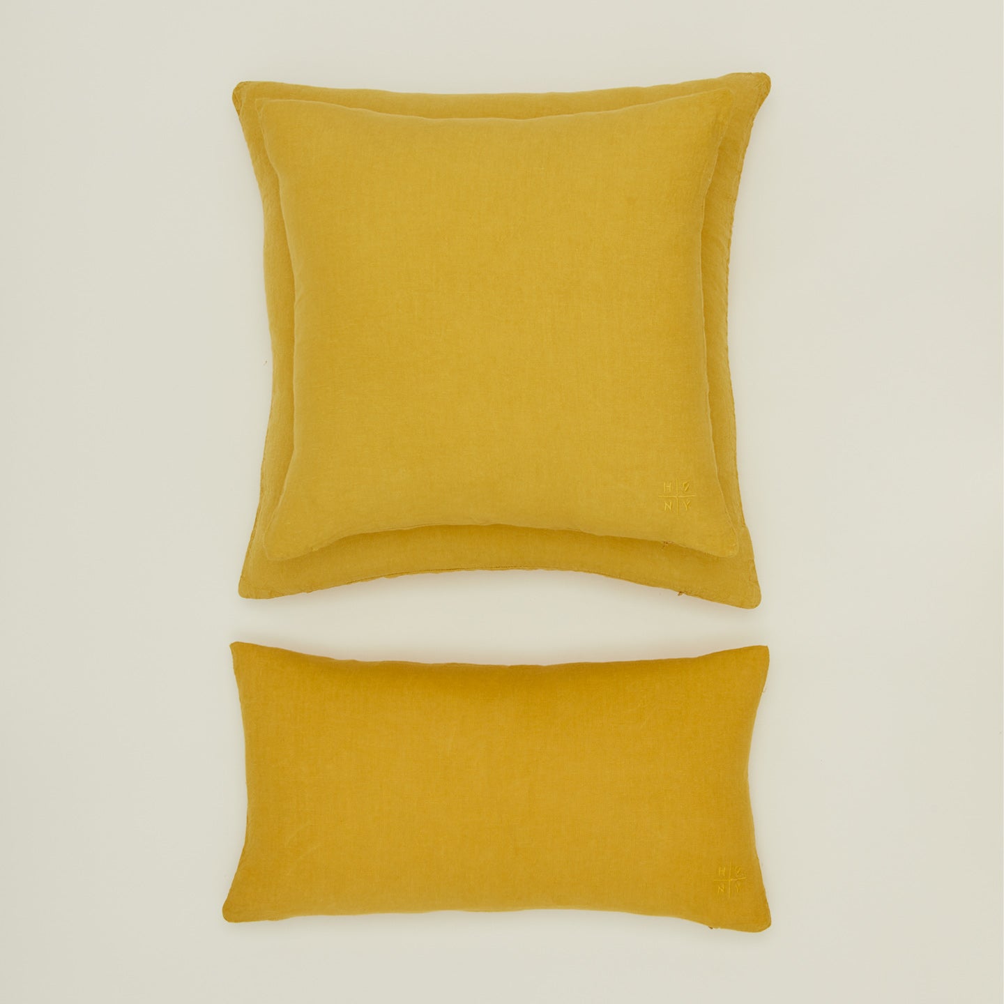 Simple linen pillow in mustard