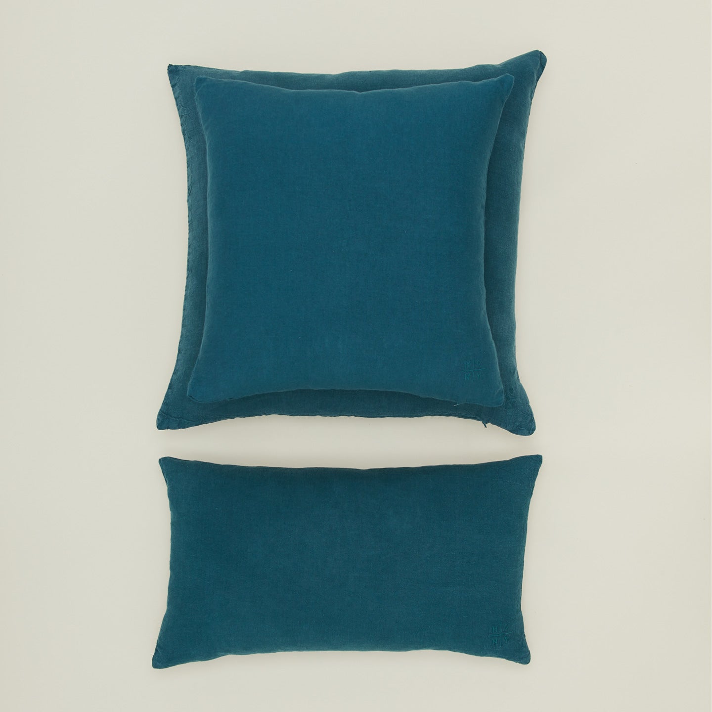 Simple linen pillow in peacock